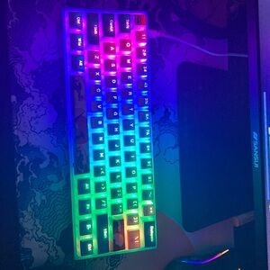 Color changing keyboard with extra keycaps, keycap remover, and manual